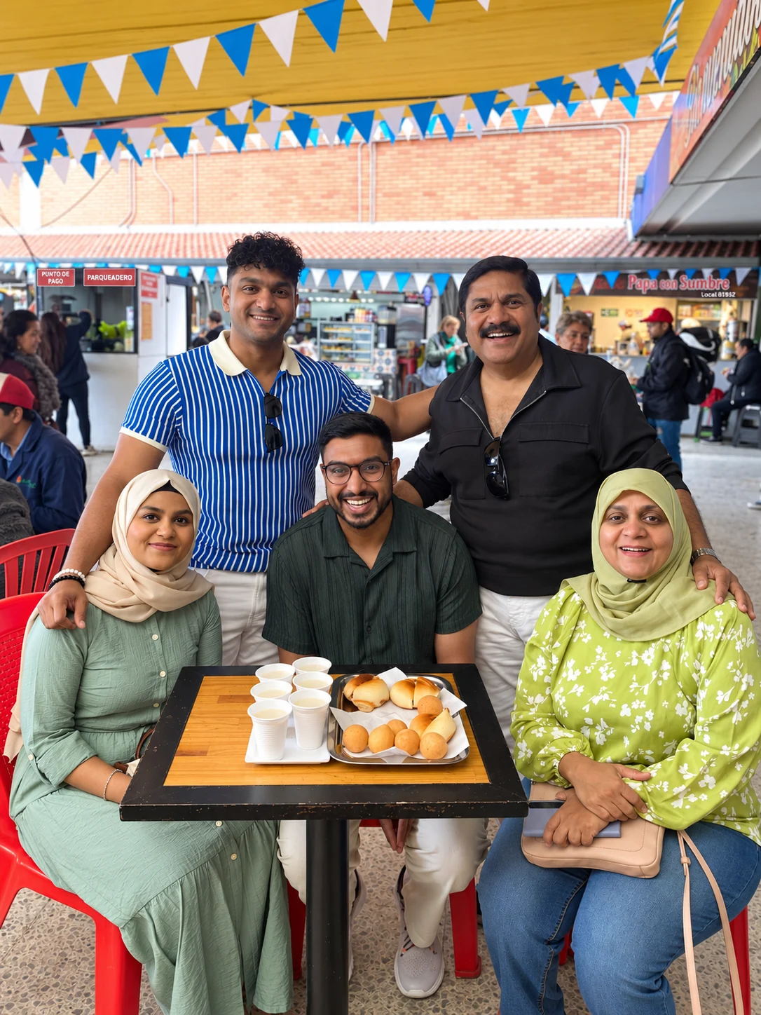 Family and friends sharing local bites at Paloquemao Market