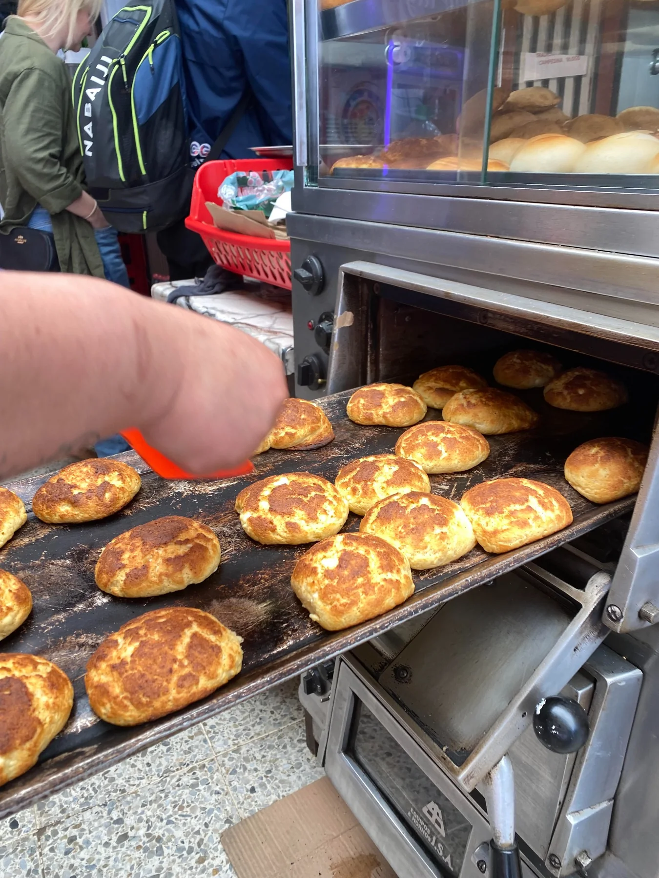 Fresh local baked goods coming out of the oven at the market